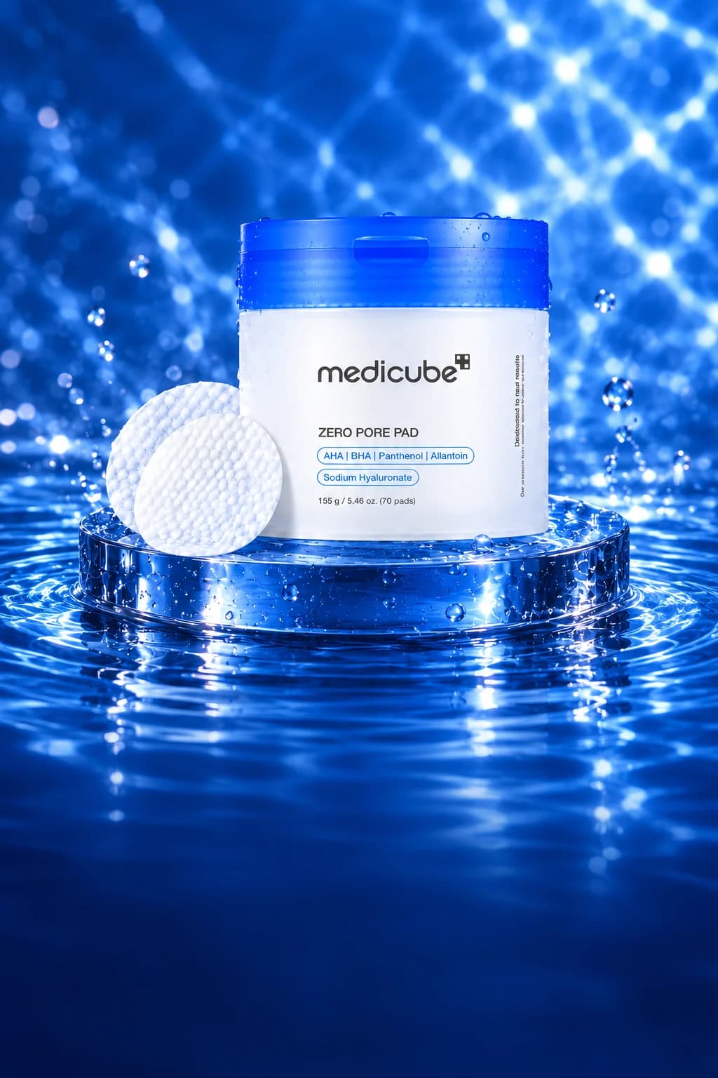 Medicube Zero Pore Pad 2.0 with two textured pads in a blue campaign over water